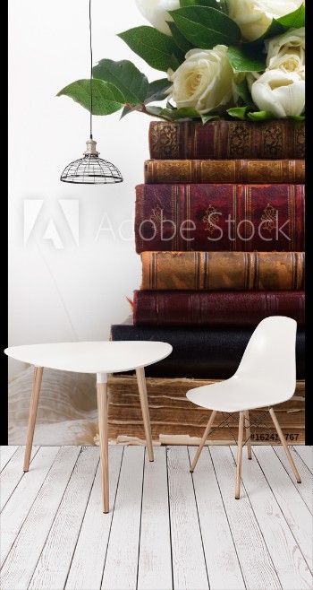 Picture of Old books with white flowers on romantic lace background close up